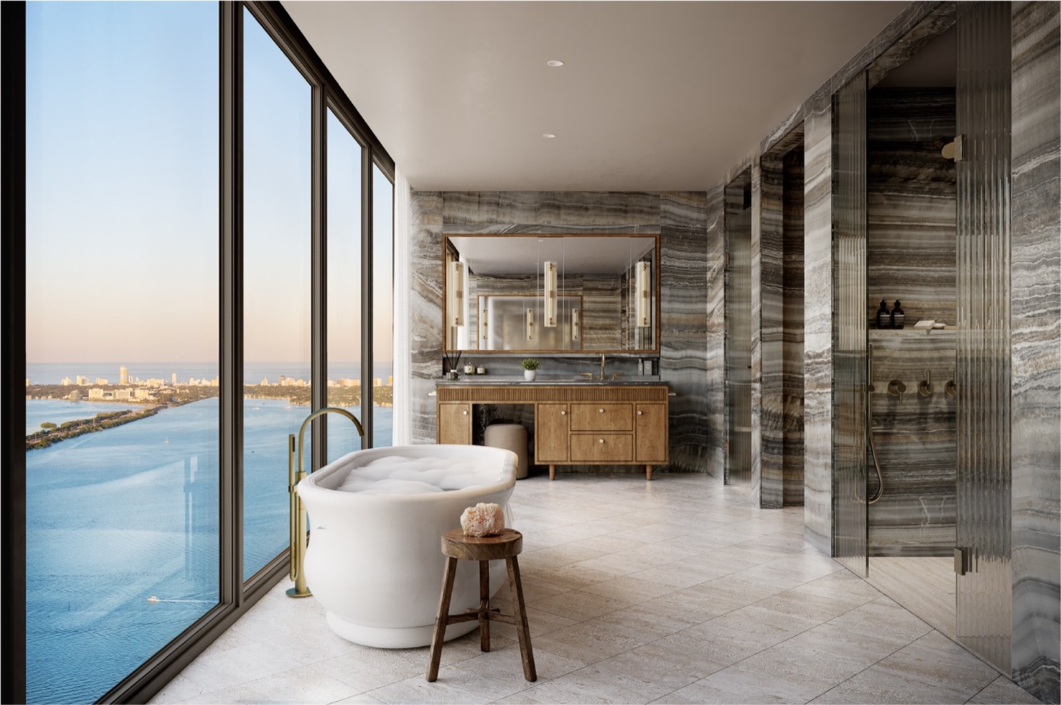 Primary en suite bath at Villa Miami — Greige Onyx porcelain walls and counter, travertine porcelain floors, fluted glass shower doors, Dornbracht and Duravit fixtures.